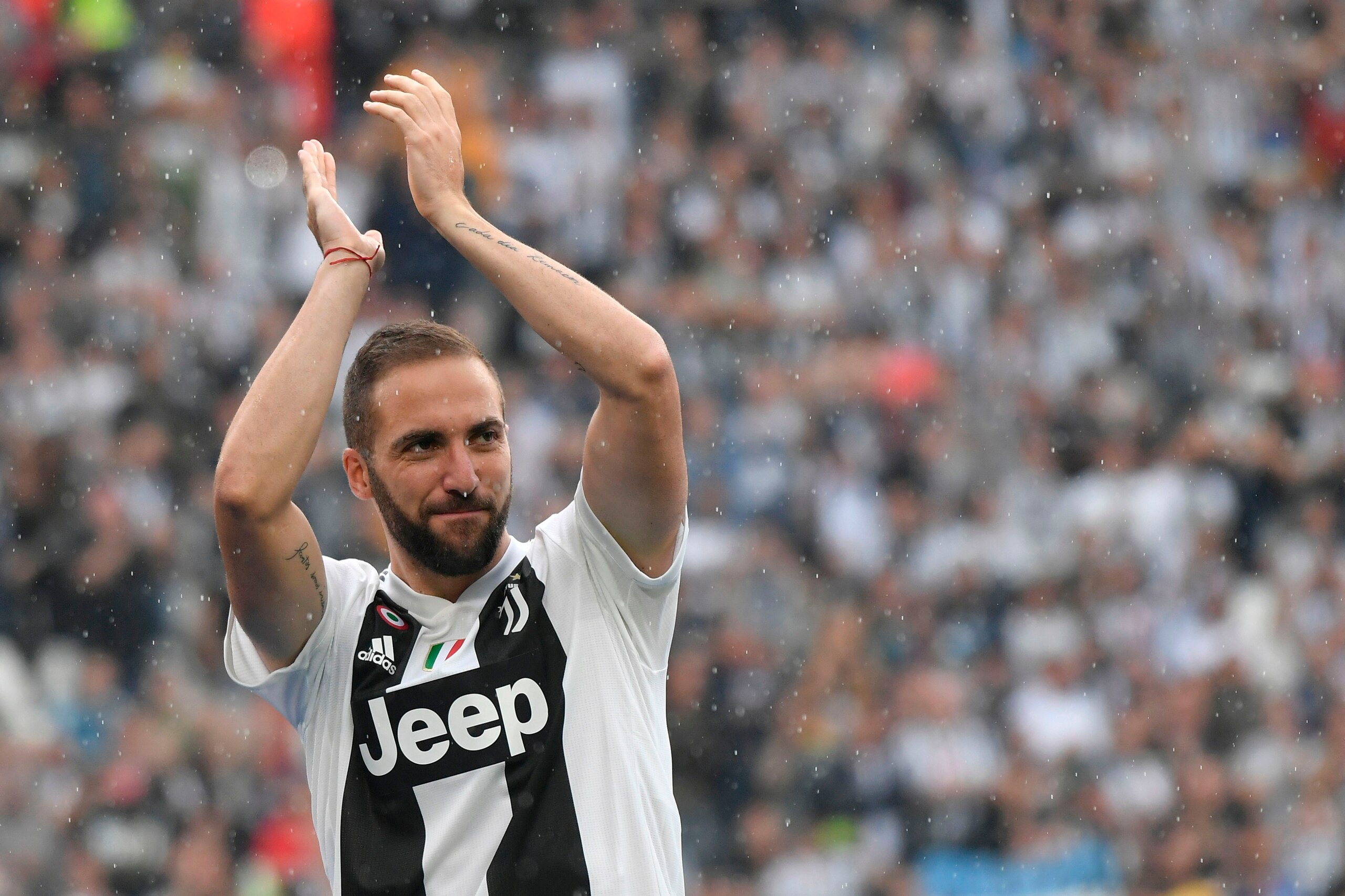 Juventus' forward from Argentina Gonzalo Higuain applauds fans during the trophy ceremony following the Italian Serie A last football match of the season Juventus versus Verona, on May 19, 2018 at the Allianz Stadium in Turin. Juventus won their 34th Seri