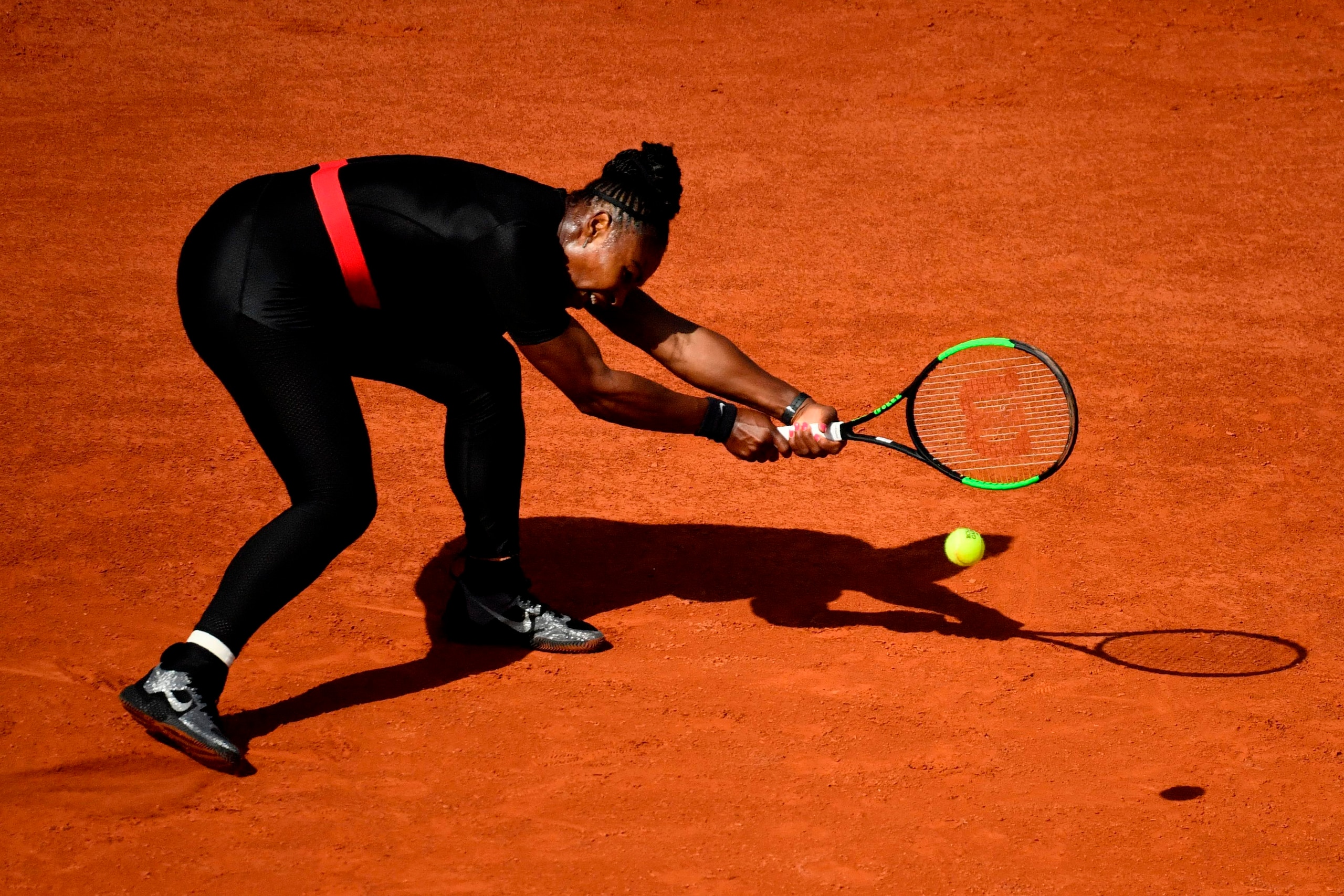 Serena Williams of the US plays a backhand return to Czech Republic's Kristyna Pliskova during their women's singles first round match on day three of The Roland Garros 2018 French Open tennis tournament in Paris on May 29, 2018. (Photo by CHRISTOPHE SIMO
