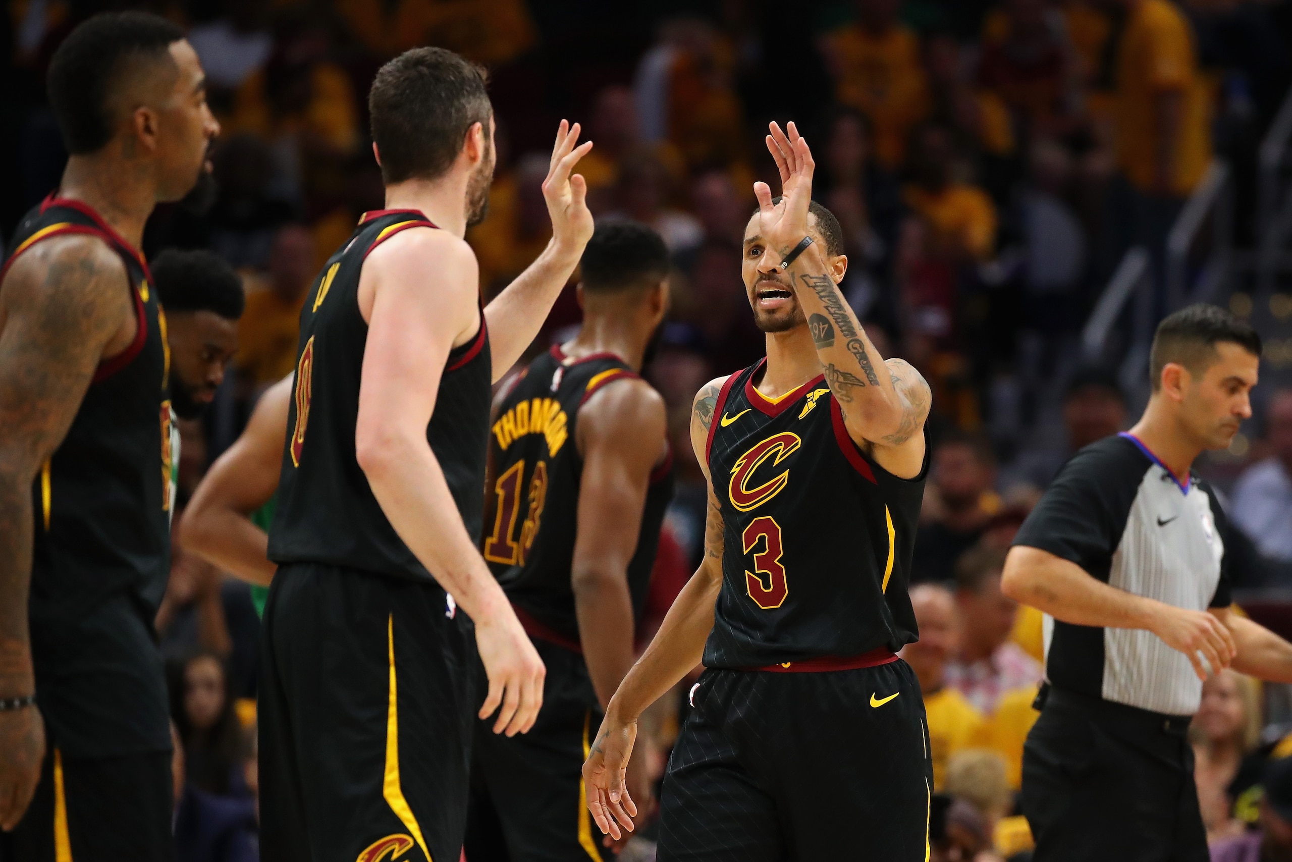 CLEVELAND, OH - MAY 19:  George Hill #3 high fives Kevin Love #0 of the Cleveland Cavaliers in the second half against the Boston Celtics during Game Three of the 2018 NBA Eastern Conference Finals at Quicken Loans Arena on May 19, 2018 in Cleveland, Ohio
