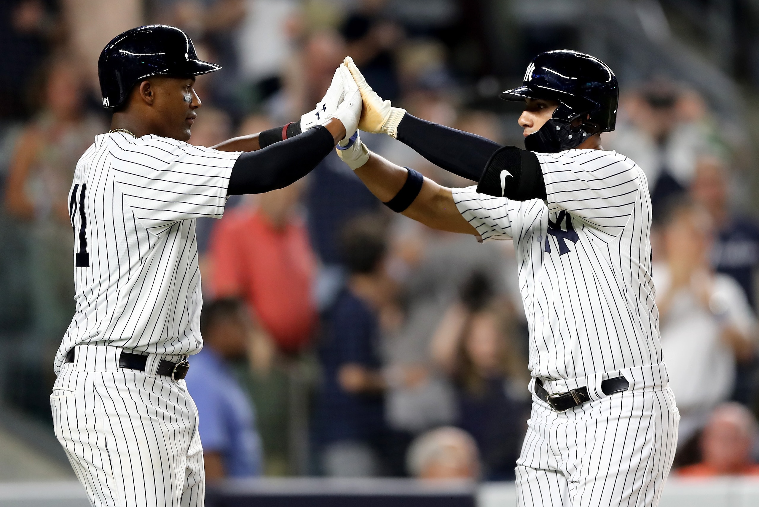 NEW YORK, NY - MAY 04:  Miguel Andujar #41 of the New York Yankees congratulates teammate Gleyber Torres #25 after Torres hit a three run home run in the fourth inning against the Cleveland Indians at Yankee Stadium on May 4, 2018 in the Bronx borough of 