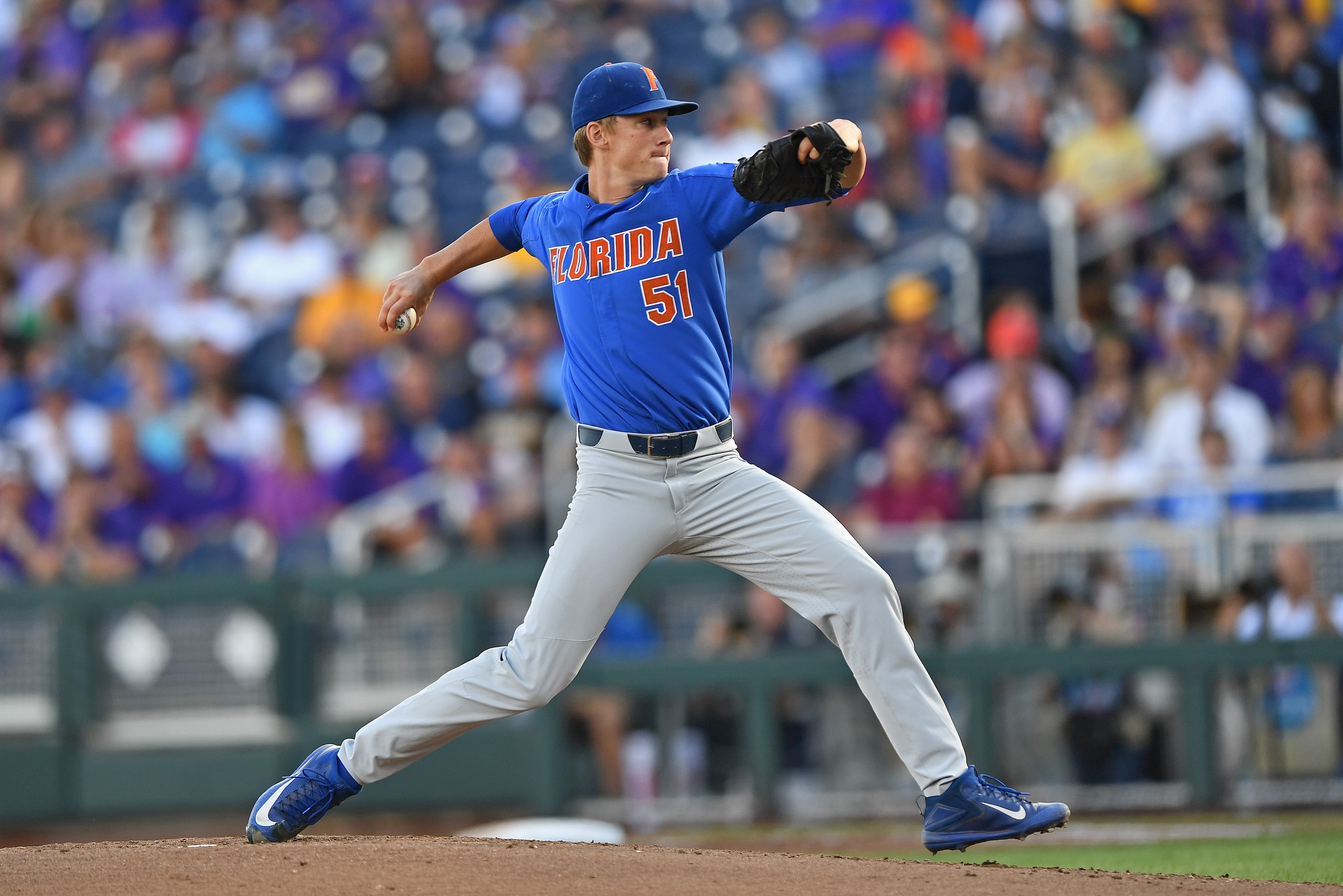 Omaha, NE - JUNE 26: Pitcher Brady Singer #51 of the Florida Gators delivers a pitch against the LSU Tigers in the first inning during game one of the College World Series Championship Series on June 26, 2017 at TD Ameritrade Park in Omaha, Nebraska. (P Omaha, NE - JUNE 26: Pitcher Brady Singer #51 of the Florida Gators delivers a pitch against the LSU Tigers in the first inning during game one of the College World Series Championship Series on June 26, 2017 at TD Ameritrade Park in Omaha, Nebraska. (P