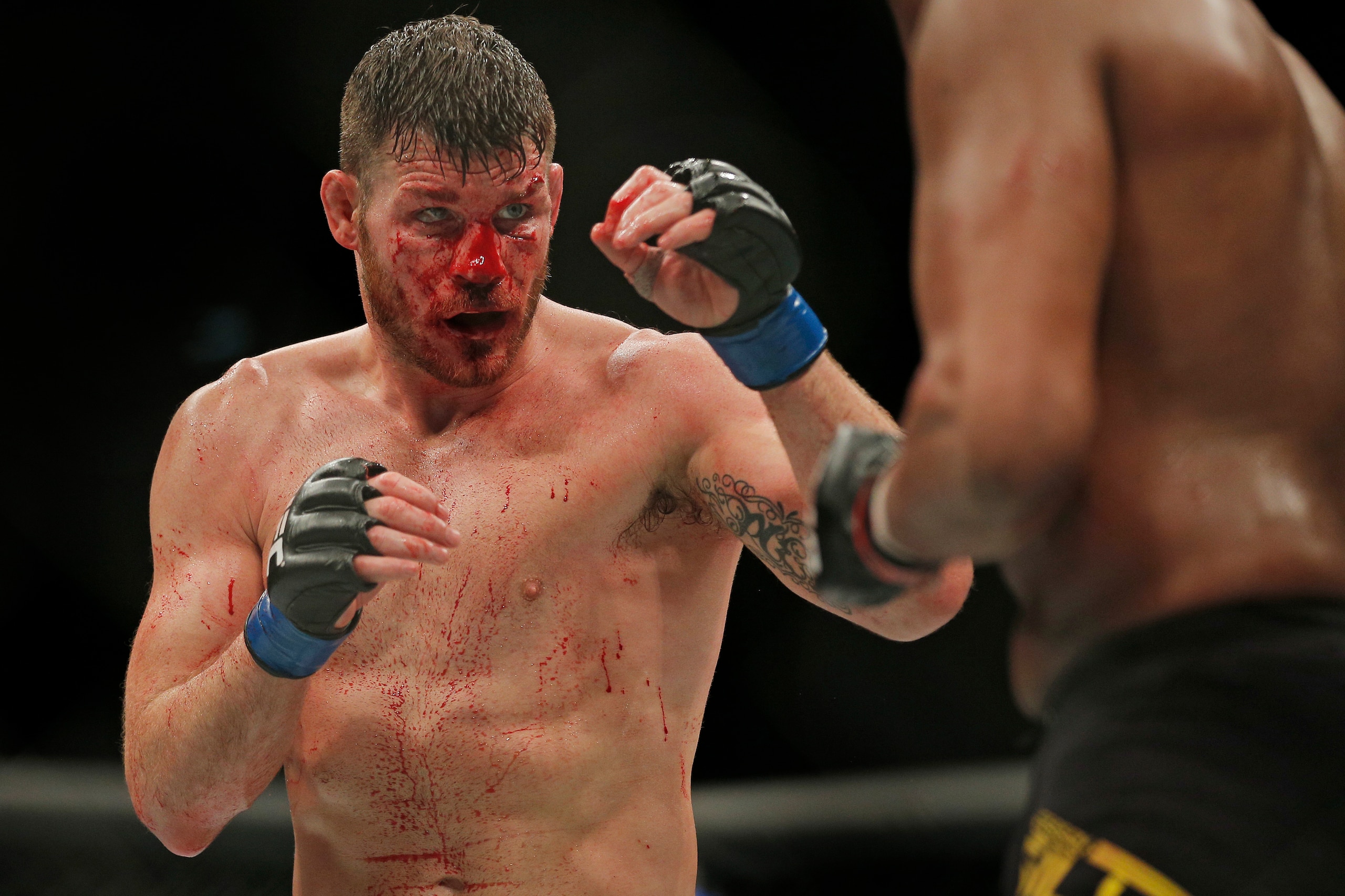 Michael Bisping of Great Britain with bloodied face during his middleweight fight versus Anderson Silva of Brazil at the UFC Ultimate Fighting Championship fight night at the O2 Arena on February 27th 2016 in London (Photo by Tom Jenkins)