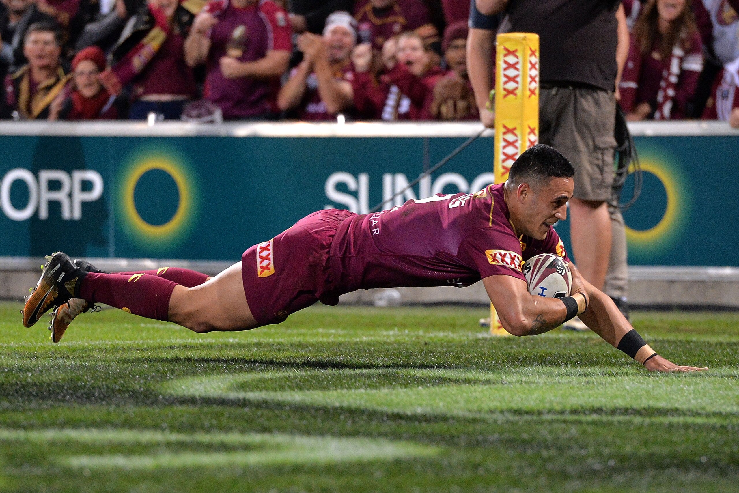 BRISBANE, AUSTRALIA - JULY 12:  Valentine Homes of the Maroons scores a try during game three of the State Of Origin series between the Queensland Maroons and the New South Wales Blues at Suncorp Stadium on July 12, 2017 in Brisbane, Australia.  (Photo by