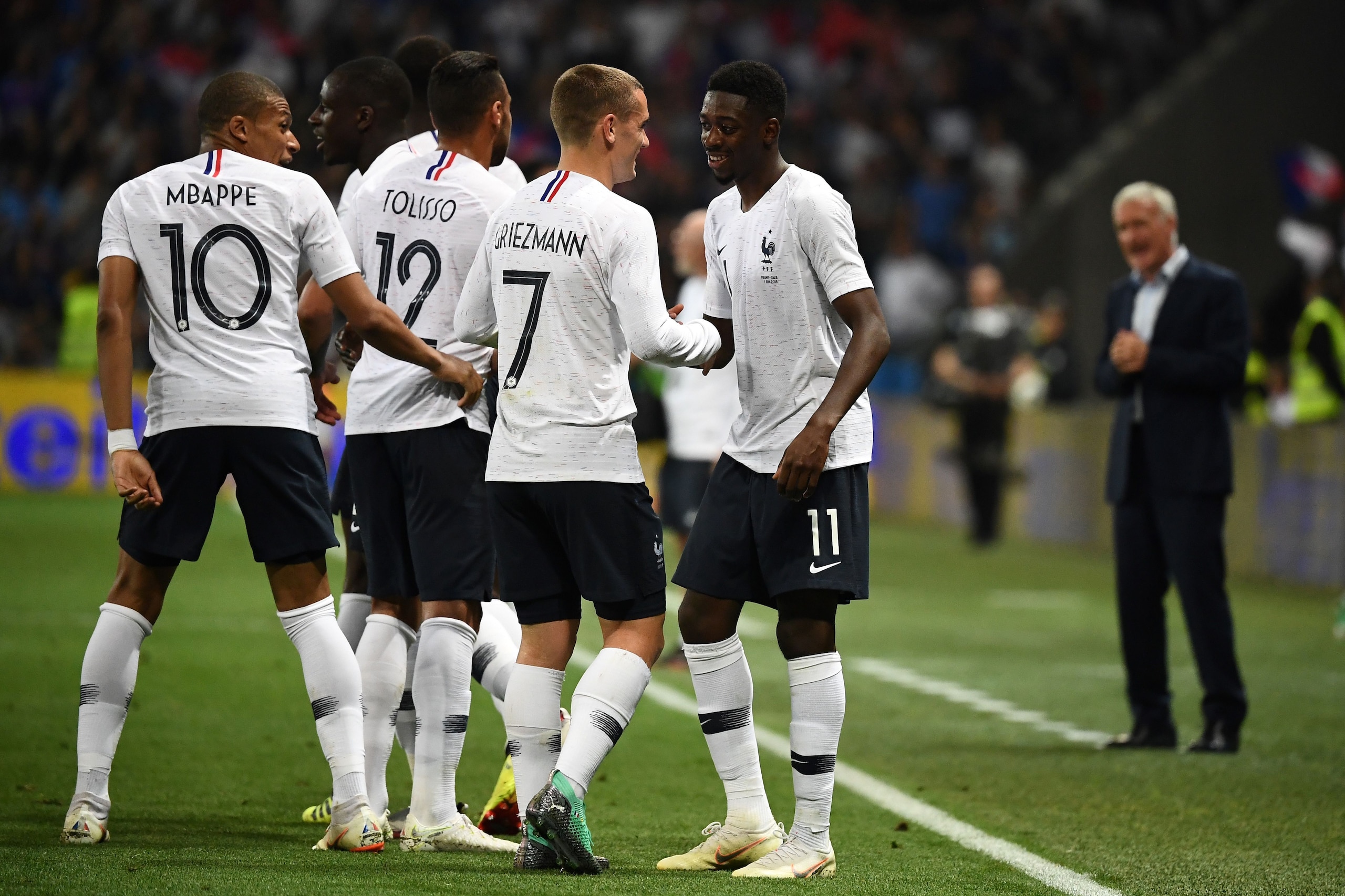 France's foward Ousmane Dembele (R) celebrates with France's foward Antoine Griezmann (2R) after scoring a goal during the friendly football match between France and Italy at the Allianz Riviera Stadium in Nice, southeastern France, on June 1, 2018. (Phot