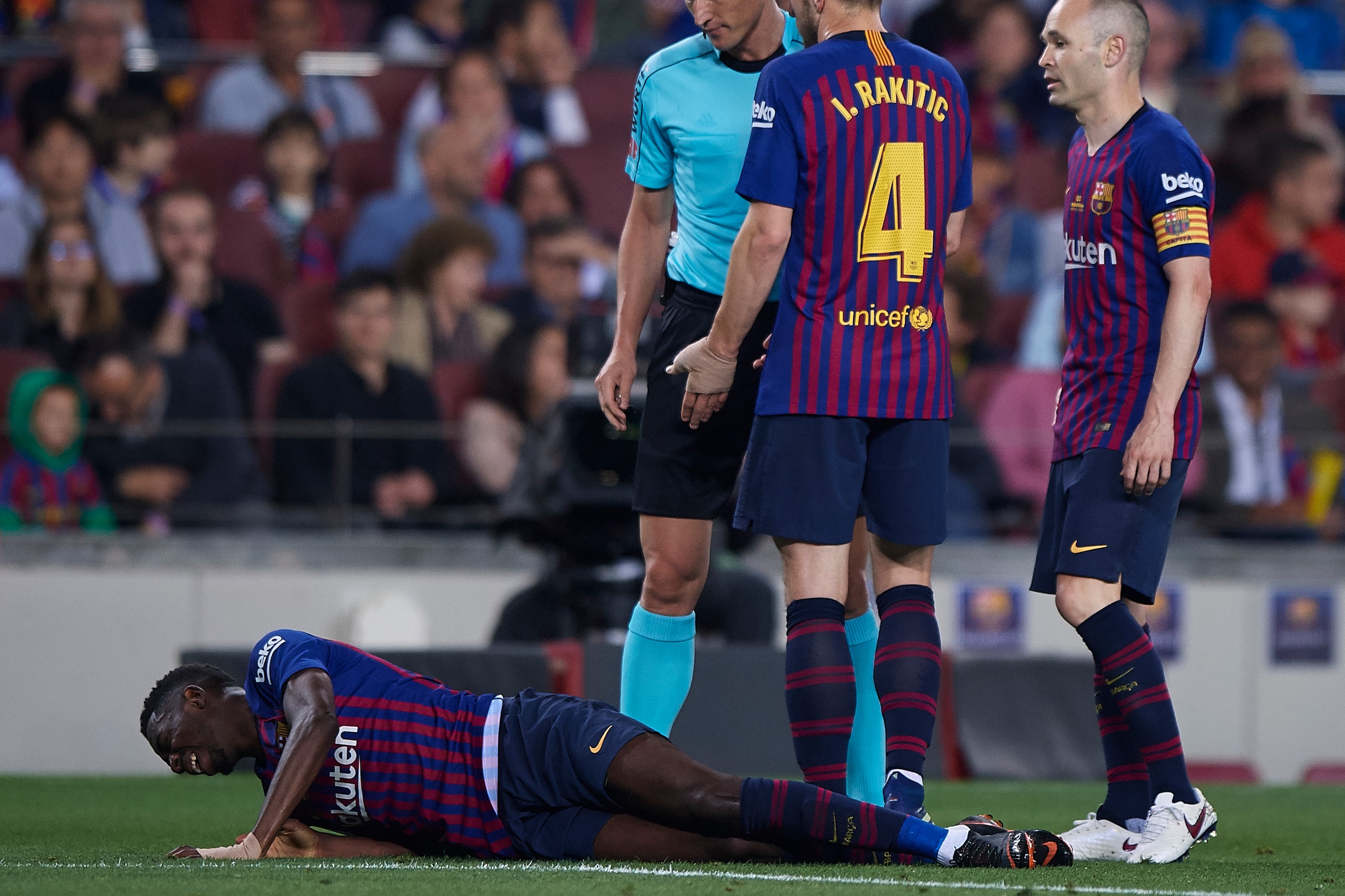 BARCELONA, SPAIN - MAY 20:  Ousmane Dembele of Barcelona lies injured on the pitch during the La Liga match between Barcelona and Real Sociedad at Camp Nou on May 20, 2018 in Barcelona, Spain.  (Photo by Quality Sport Images/Getty Images)