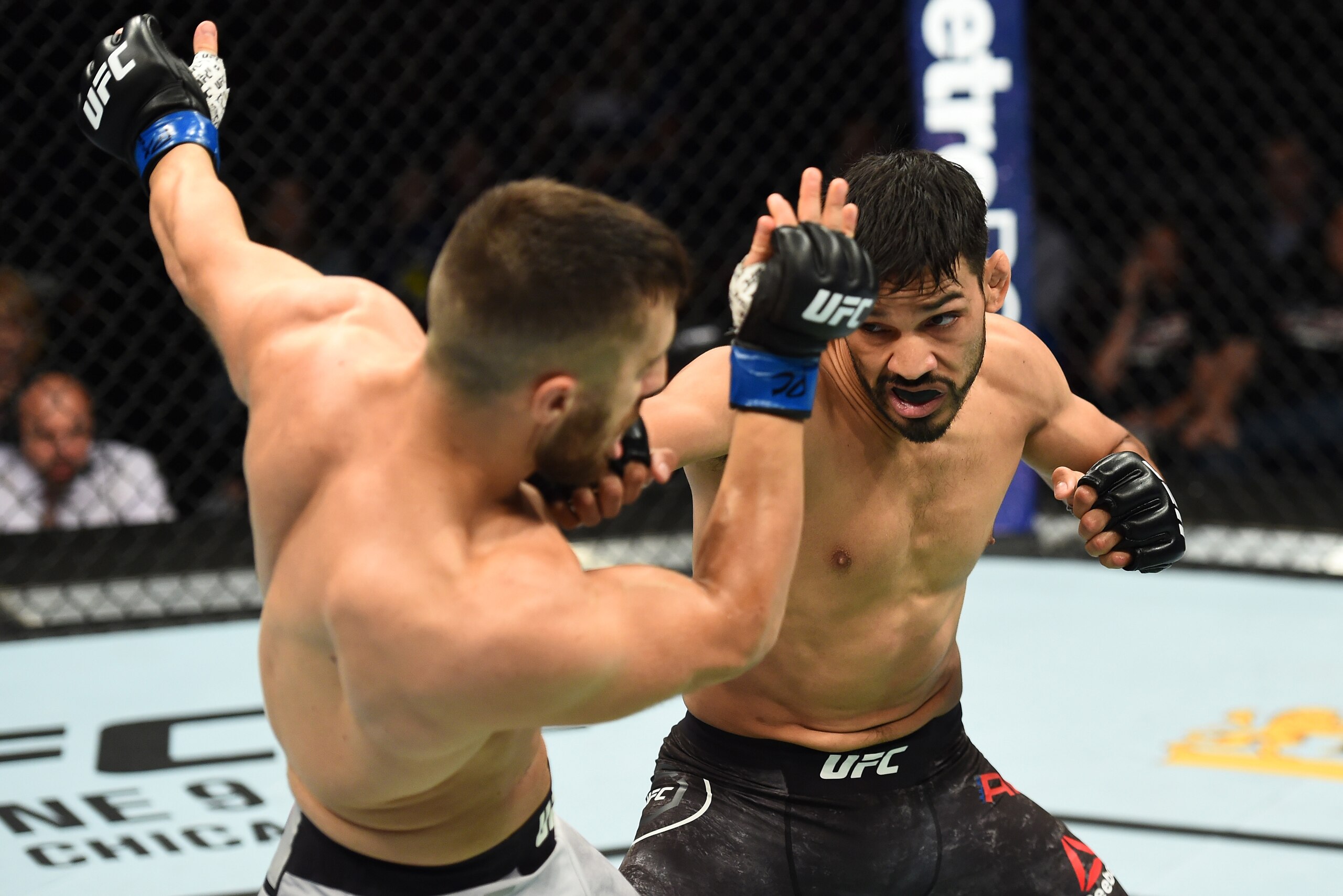 UTICA, NY - JUNE 01:  (R-L) Julio Arce punches Daniel Teymur of Sweden in their featherweight fight during the UFC Fight Night event at the Adirondack Bank Center on June 1, 2018 in Utica, New York. (Photo by Josh Hedges/Zuffa LLC/Zuffa LLC via Getty Imag
