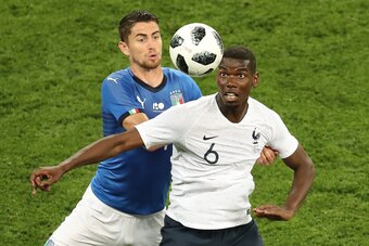 France's midfielder Paul Pogba (L) vies for the ball with Italy's midfielder Jorginho during the friendly football match between France and Italy at the Allianz Riviera Stadium in Nice, southeastern France, on June 1, 2018. (Photo by VALERY HACHE / AFP)  