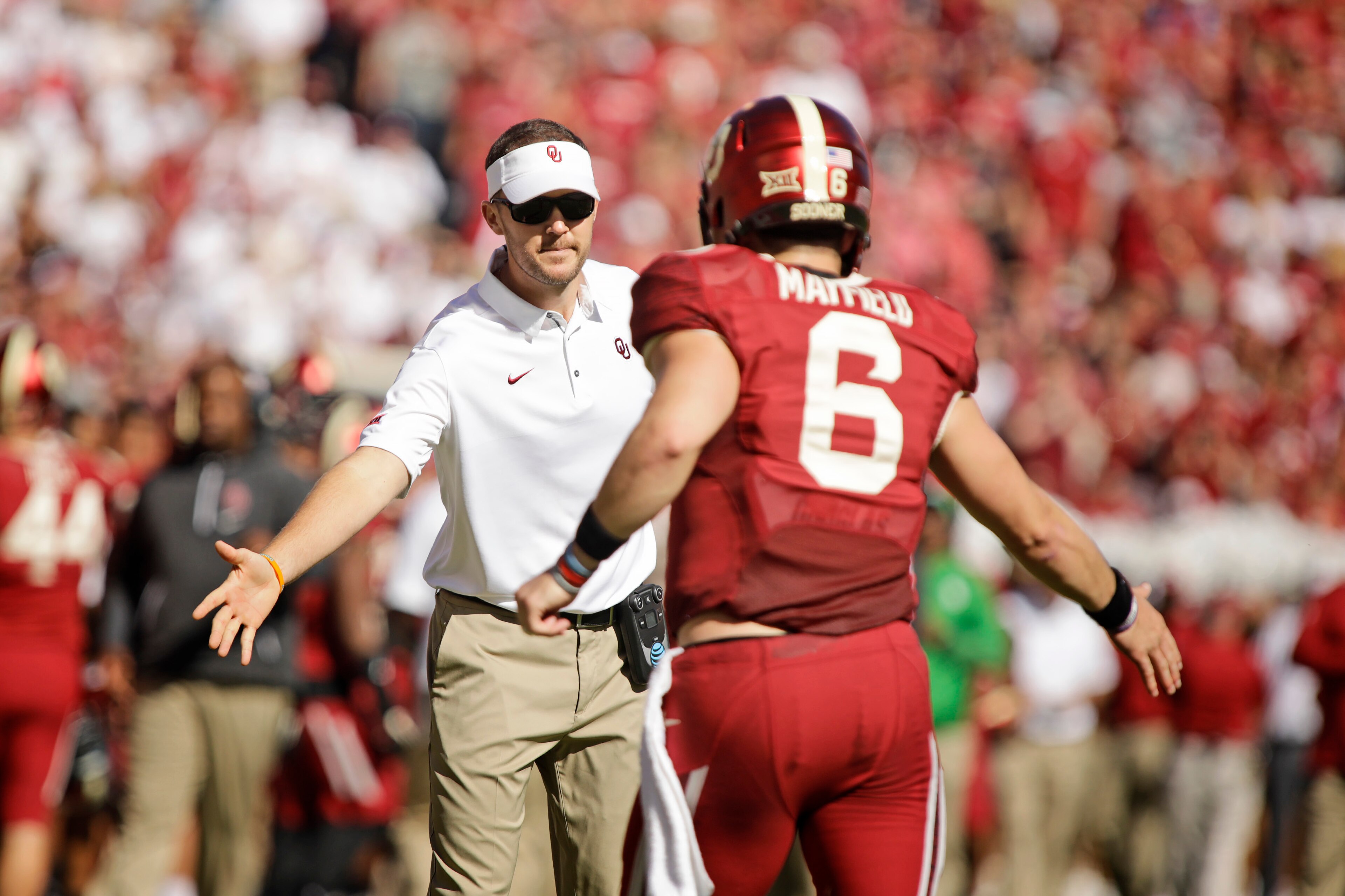 NORMAN, OK - OCTOBER 07: Head Coach Lincoln Riley congratulates quarterback Baker Mayfield #6 of the Oklahoma Sooners after a touchdown against the Iowa State Cyclones at Gaylord Family Oklahoma Memorial Stadium on October 7, 2017 in Norman, Oklahoma. Iow