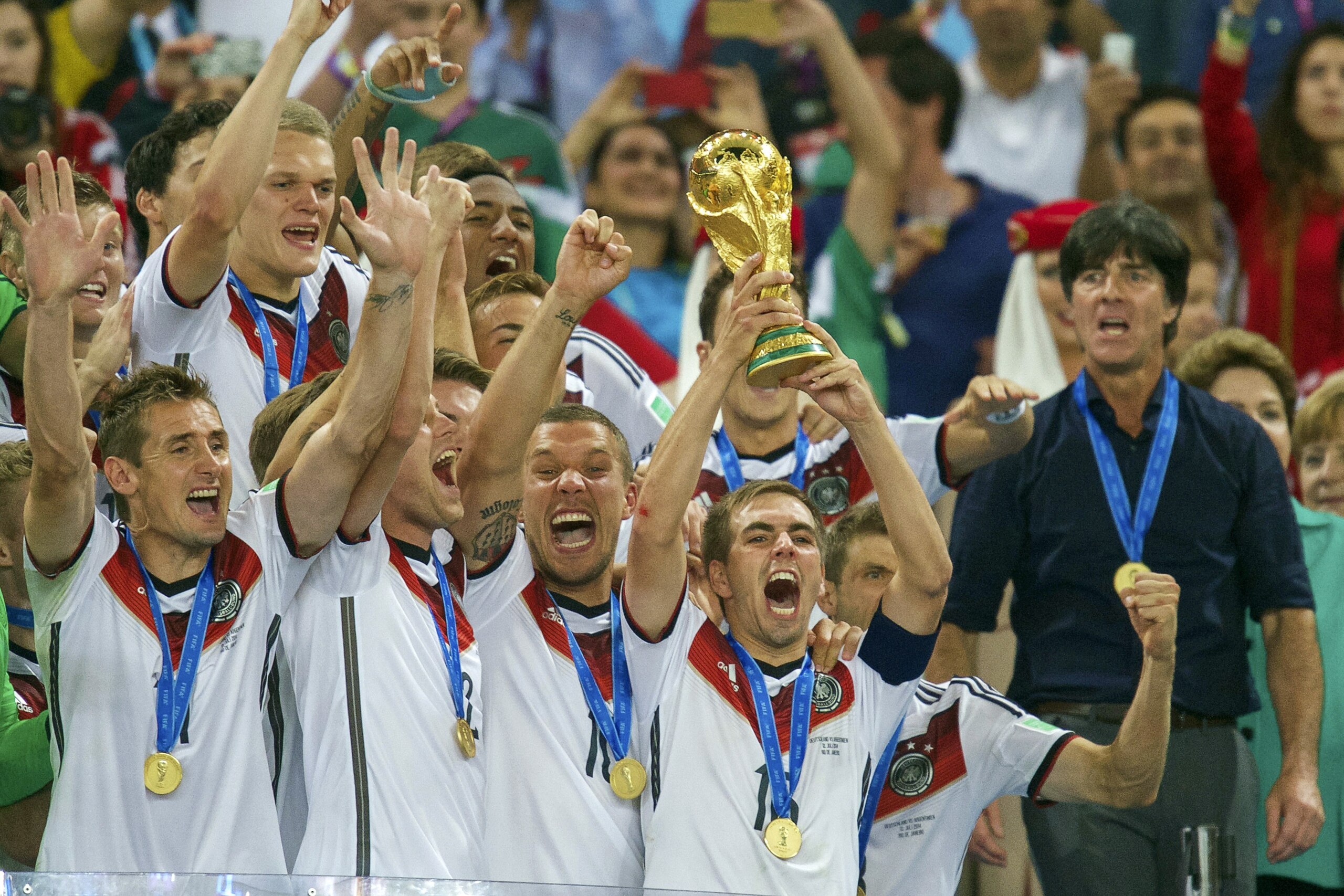 (L-R) Miroslav Klose of Germany, Kevin Grosskreutz of Germany, Lukas Podolski of Germany, Philipp Lahm of Germany, Matthias Ginter of Germany, coach Joachim Low of Germany  Germany with world cup trophy during the final of the FIFA World Cup 2014 on July 