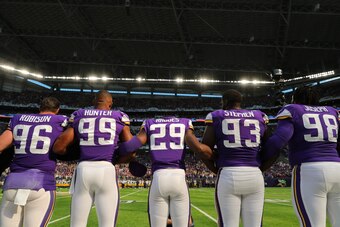 MINNEAPOLIS, MN - OCTOBER 15: Minnesota Vikings players lock arms during the national anthem before a game against the Green Bay Packers on October 15, 2017 at US Bank Stadium in Minneapolis, Minnesota. (Photo by Adam Bettcher/Getty Images)