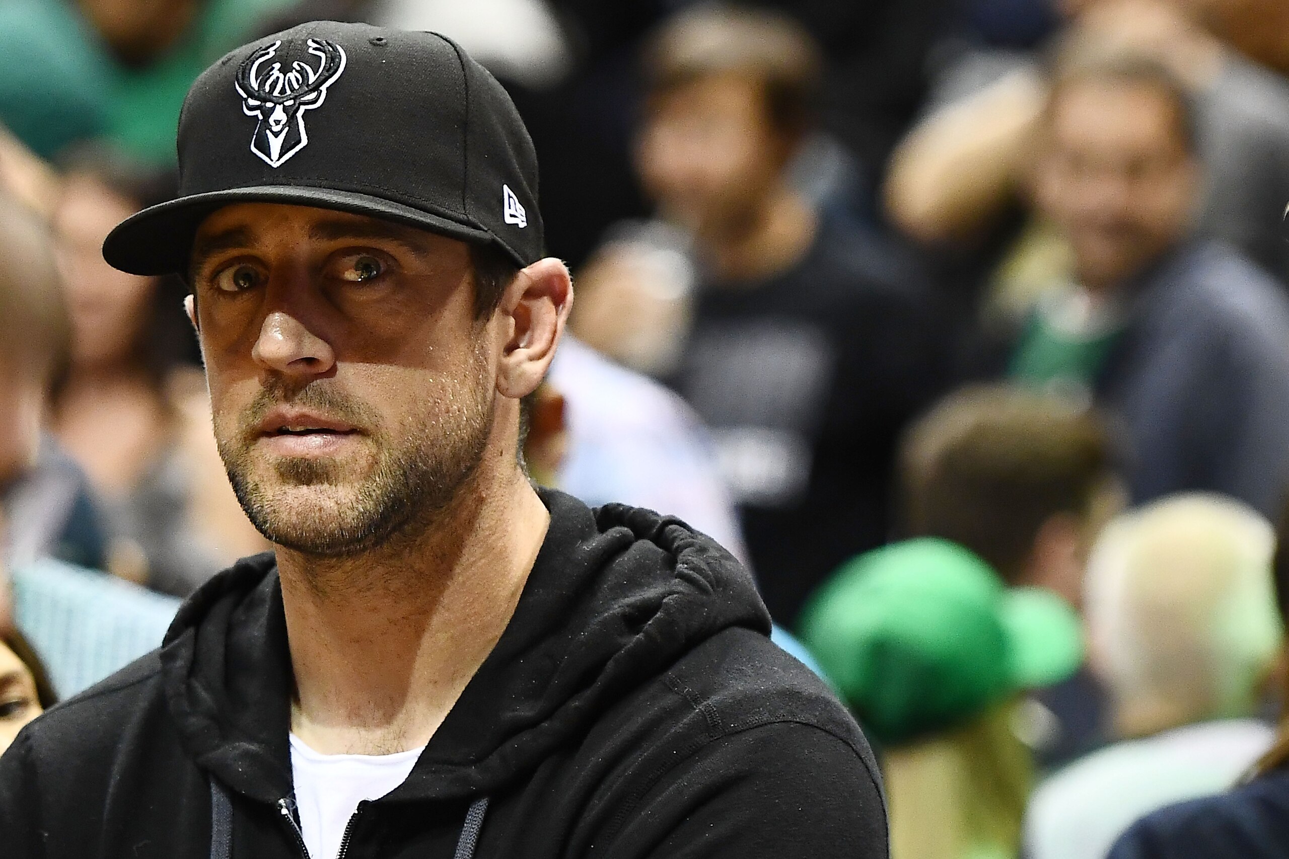 MILWAUKEE, WI - APRIL 20:  Quarterback Aaron Rodgers of the Green Bay Packers watches action during game three of round one of the Eastern Conference playoffs between the Milwaukee Bucks and the Boston Celtics at the Bradley Center on April 20, 2018 in Mi