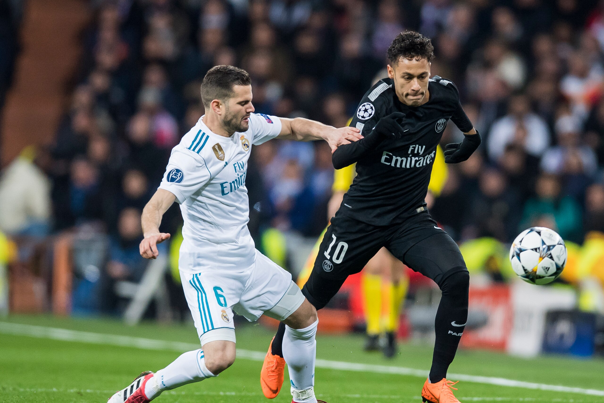 MADRID, SPAIN - FEBRUARY 14: Neymar da Silva Santos Junior, Neymar Jr (R), of Paris Saint Germain fights for the ball with Nacho Fernandez of Real Madrid during the UEFA Champions League 2017-18 Round of 16 (1st leg) match between Real Madrid vs Paris Sai