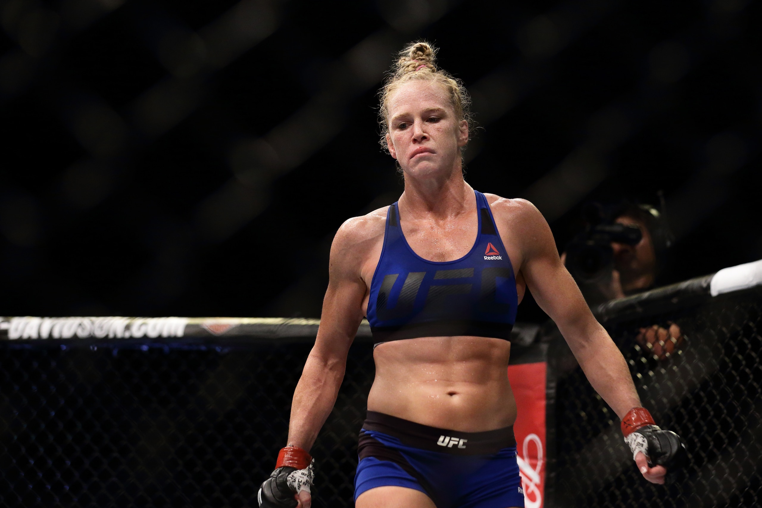SINGAPORE - JUNE 17:  Holly Holm of United States reacts after defeating Bethe Correia of Brazil  in the WomenÕs Bantamweight Main Event Bout during UFC Singapore Fight Night at Singapore Indoor Stadium on June 17, 2017 in Singapore.  (Photo by Suhaimi Ab