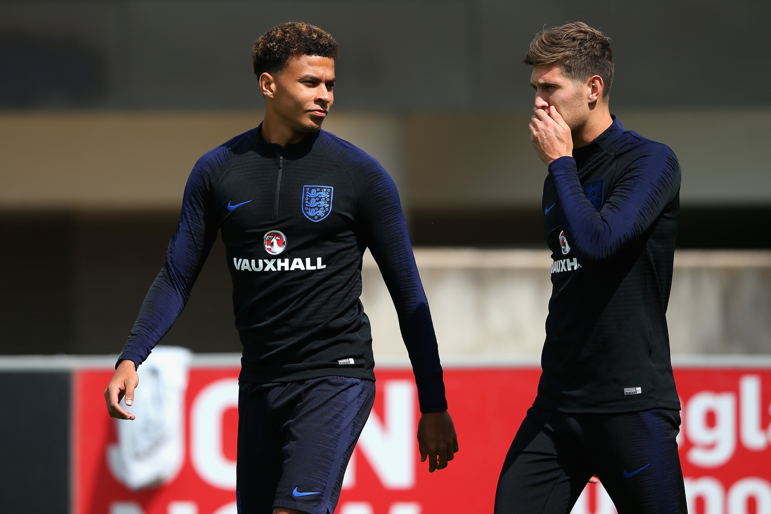 BURTON-UPON-TRENT, ENGLAND - JUNE 06:  Dele Alli of England speaks to John Stones of England during the England training session at St Georges Park on June 6, 2018 in Burton-upon-Trent, England.  (Photo by Alex Livesey/Getty Images)