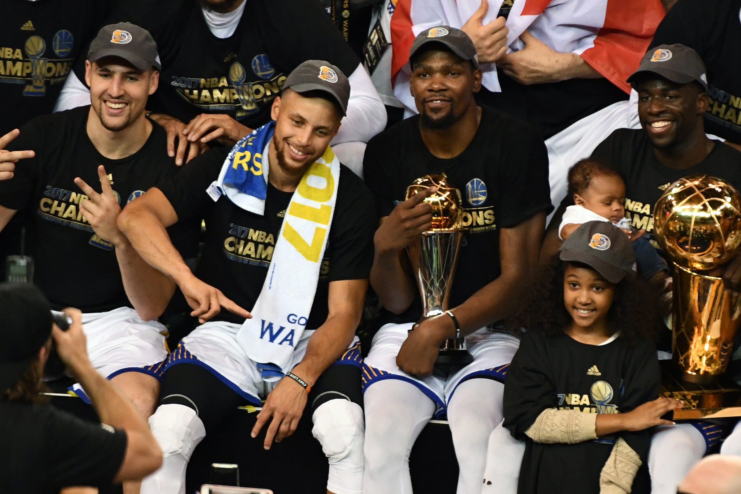 OAKLAND, CA - JUNE 12:  Klay Thompson #11, Stephen Curry #30, Kevin Durant #35 and Draymond Green #23 of the Golden State Warriors pose for a team photo after winning the NBA Championship and defeating the Cleveland Cavaliers in Game Five of the 2017 NBA 