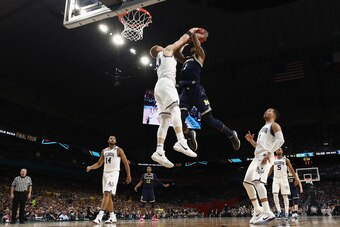 SAN ANTONIO, TX - APRIL 02:  Donte DiVincenzo #10 of the Villanova Wildcats defends Charles Matthews #1 of the Michigan Wolverines in the second half during the 2018 NCAA Men's Final Four National Championship game at the Alamodome on April 2, 2018 in San
