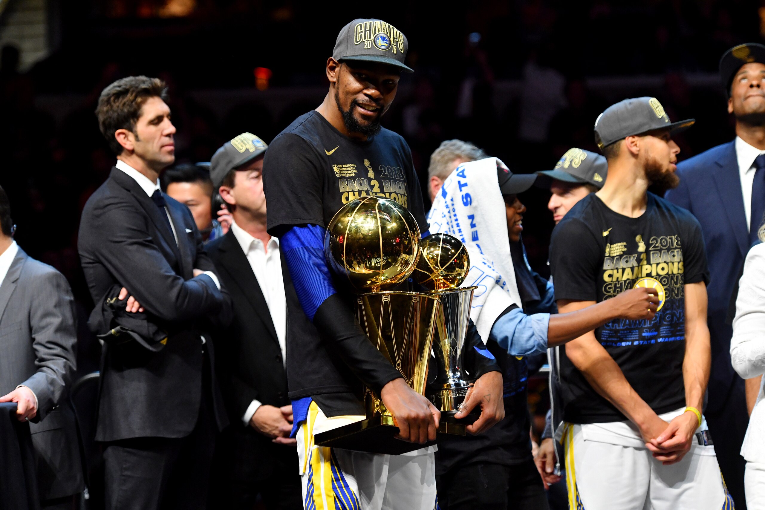 CLEVELAND, OH - JUNE 8: Kevin Durant #35 of the Golden State Warriors poses for a photo with the Larry O'Brien Championship trophy and the Bill Russell Finals MVP trophy after defeating the Cleveland Cavaliers in Game Four of the 2018 NBA Finals on June 8