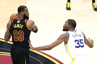 CLEVELAND,OH - LeBron James #23 of the Cleveland Cavaliers handles the ball against Kevin Durant #35 of the Golden State Warriors in Game Four of the 2018 NBA Finals on June 8, 2018 at Quicken Loans Arena in Cleveland, Ohio. NOTE TO USER: User expressly a