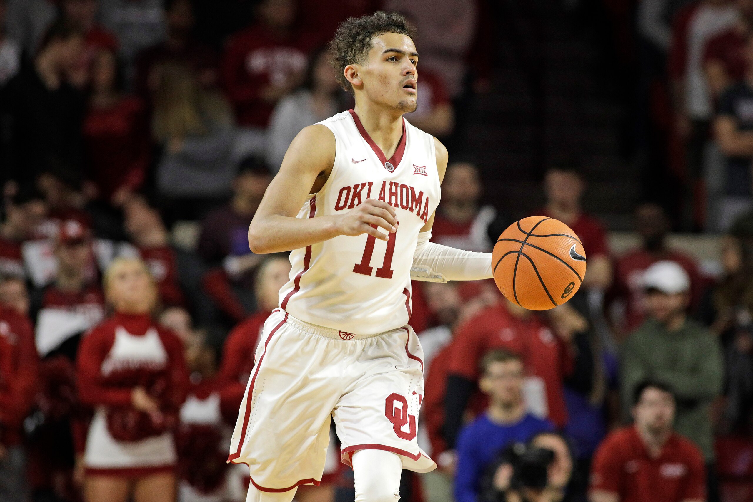 NORMAN, OK - FEBRUARY 17: Trae Young #11 of the Oklahoma Sooners dribbles down court during the game against the Texas Longhorns at Lloyd Noble Center on February 24, 2018 in Norman, Oklahoma. The Longhorns defeated the Sooners 77-66. (Photo by Brett Deer