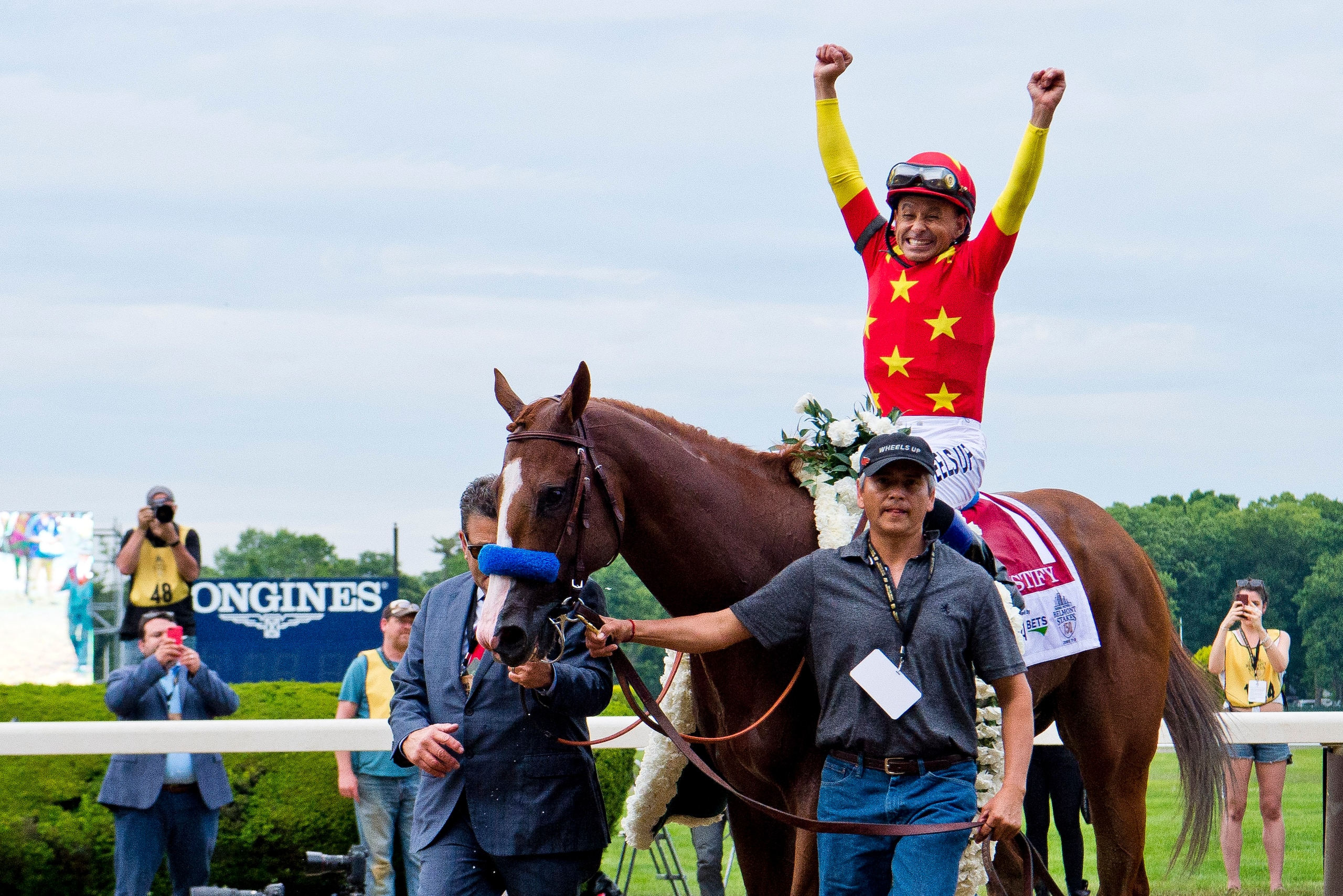 ELMONT, NY - JUNE 09: Jockey Mike Smith celebrates his win aboard #1, Justify during the 150th running of the Belmont Stakes on Belmont Stakes Day at Belmont Park on June 9, 2018 in Elmont, New York. (Photo by Eric Patterson/Eclipse Sportswire/Getty Image