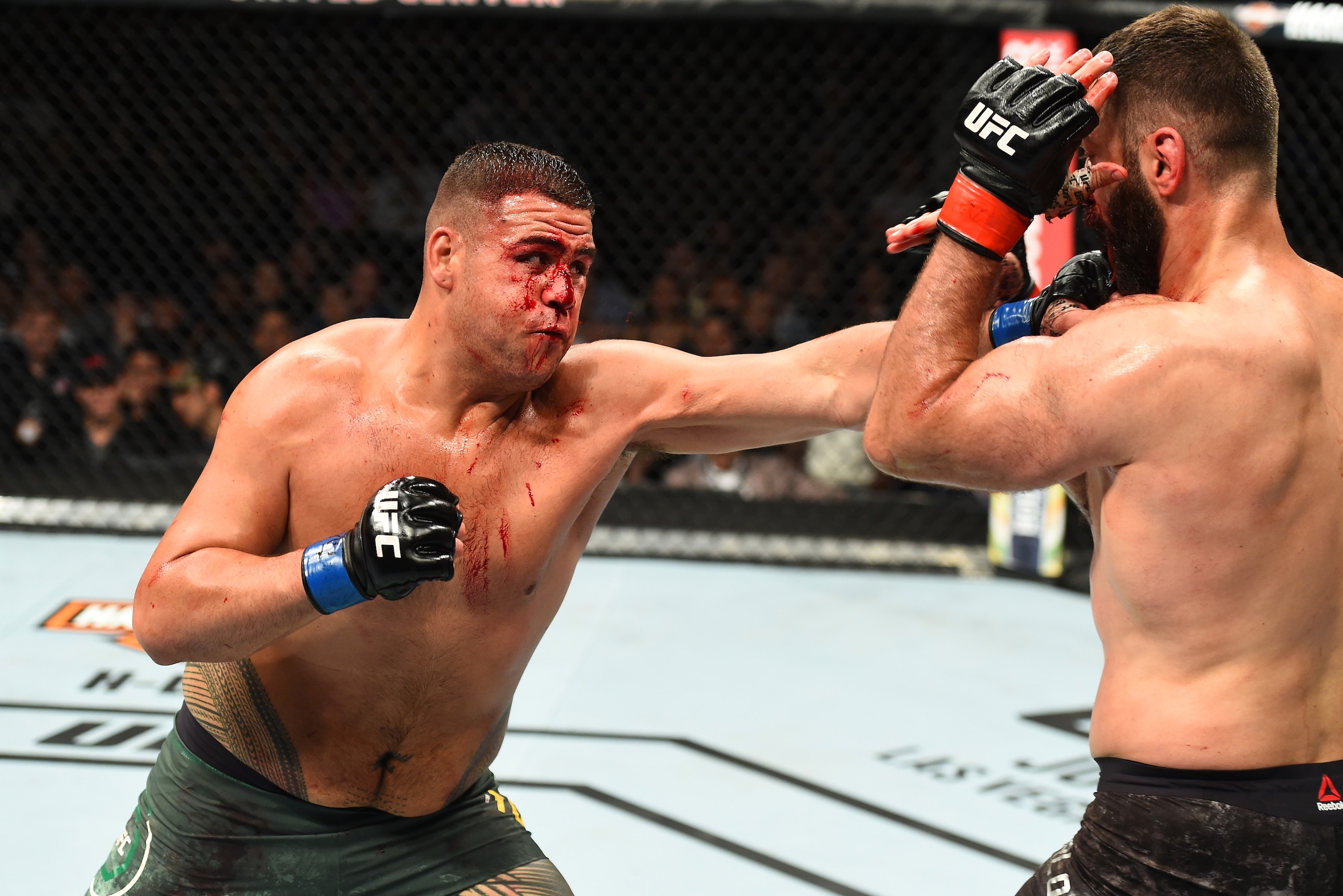 CHICAGO, ILLINOIS - JUNE 09:  (L-R) Tai Tuivasa of Australia punches Andrei Arlovski of Belarus in their heavyweight fight during the UFC 225 event at the United Center on June 9, 2018 in Chicago, Illinois. (Photo by Josh Hedges/Zuffa LLC/Zuffa LLC via Ge