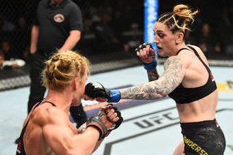 CHICAGO, ILLINOIS - JUNE 09:  (R-L) Megan Anderson of Australia punches Holly Holm in their women's featherweight fight during the UFC 225 event at the United Center on June 9, 2018 in Chicago, Illinois. (Photo by Josh Hedges/Zuffa LLC/Zuffa LLC via Getty