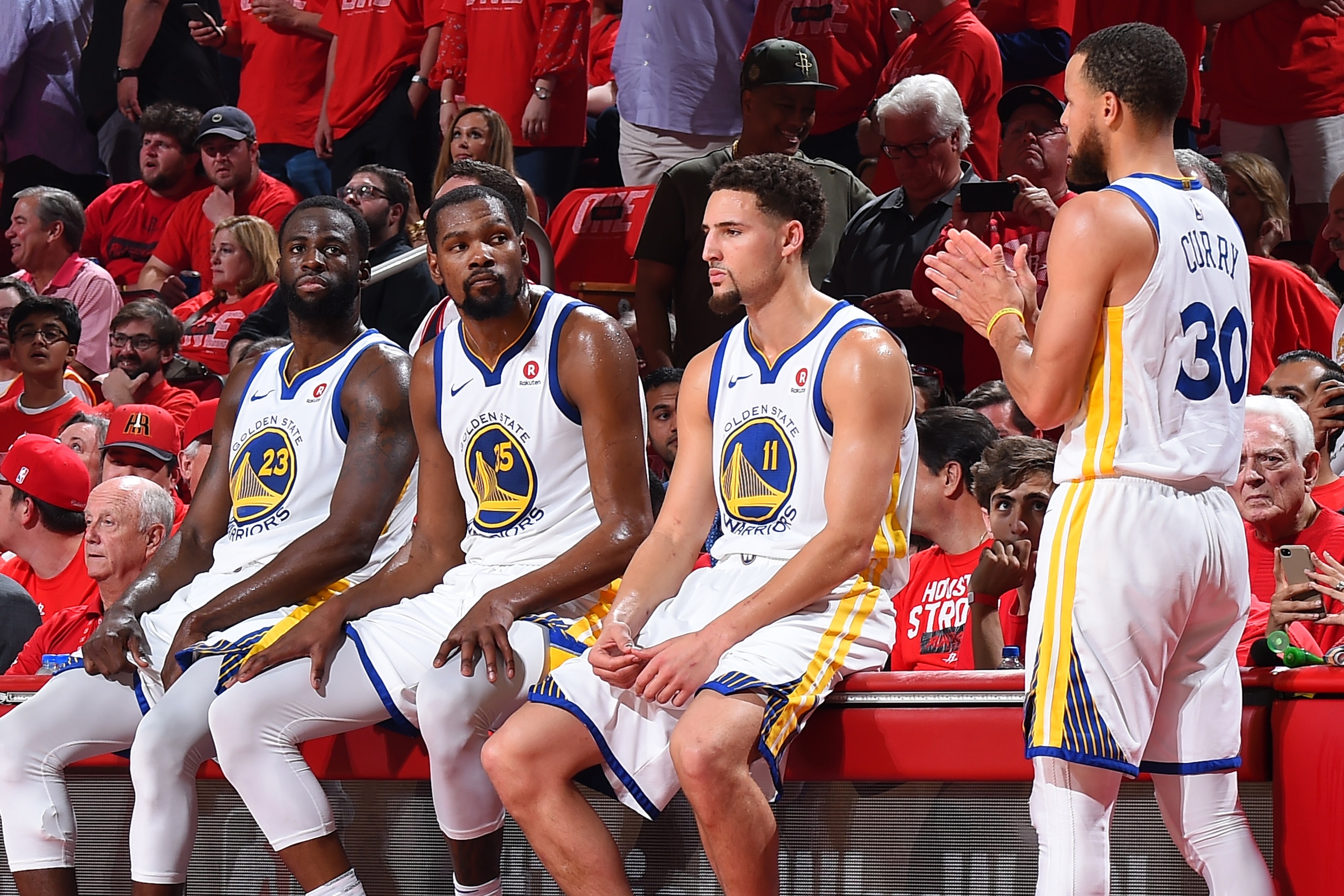 HOUSTON, TX - MAY 28: Draymond Green #23, Kevin Durant #35, Klay Thompson #11, and Stephen Curry #30 of the Golden State Warriors look on in Game Seven of the Western Conference Finals against the Houston Rockets during the 2018 NBA Playoffs on May 28, 20 HOUSTON, TX - MAY 28: Draymond Green #23, Kevin Durant #35, Klay Thompson #11, and Stephen Curry #30 of the Golden State Warriors look on in Game Seven of the Western Conference Finals against the Houston Rockets during the 2018 NBA Playoffs on May 28, 20