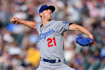DENVER, CO - JUNE 02: Walker Buehler #21 of the Los Angeles Dodgers pitches against the Colorado Rockies in the second inning of a game at Coors Field on June 2, 2018 in Denver, Colorado.  (Photo by Dustin Bradford/Getty Images)