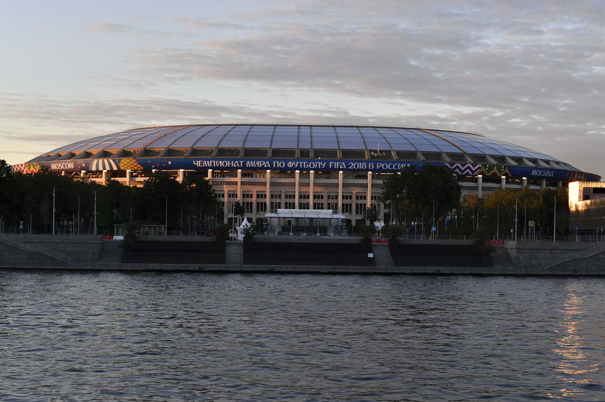 View from the Moskva River of the Luzhniki Olympic stadium during a FIFA press tour ahead of the Russia 2018 World Cup in Moscow on June 9, 2018. - The opening and final matches of the FIFA World Cup 2018 will be played at Luzhniki stadium. (Photo by YURI