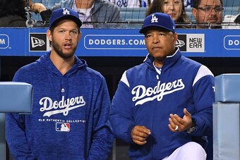LOS ANGELES, CA - MAY 22:  Clayton Kershaw #22 talks with Dave Roberts #30 of the Los Angeles Dodgers during the game against the Colorado Rockies at Dodger Stadium on May 22, 2018 in Los Angeles, California.  (Photo by Jayne Kamin-Oncea/Getty Images).