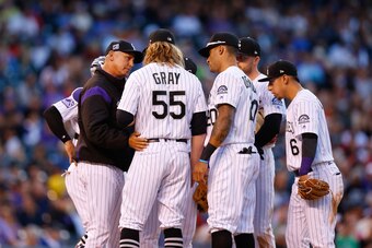 DENVER, CO - MAY 30:  Manager Bud Black of the Colorado Rockies chats with starting pitcher Jon Gray #55 as the infielders look on during the fourth inning against the San Francisco Giants at Coors Field on May 30, 2018 in Denver, Colorado. (Photo by Just