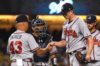 LOS ANGELES, CA - JUNE 08:  Brandon McCarthy #32 of the Atlanta Braves is pulled from the game by coach Brian Snitker #43 in the fifth inning against the Los Angeles Dodgers at Dodger Stadium on June 8, 2018 in Los Angeles, California.  (Photo by Jayne Ka