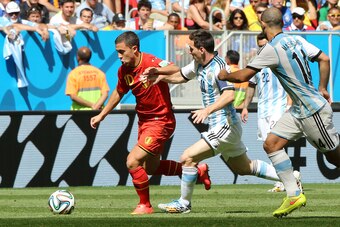 BRASILIA, BRAZIL - JULY 5: Eden Hazard of Belgium and Lionel Messi of Argentina in action during the 2014 FIFA World Cup Brazil Quarter Final match between Argentina and Belgium at Estadio Nacional on July 5, 2014 in Brasilia, Brazil. (Photo by Jean Catuf
