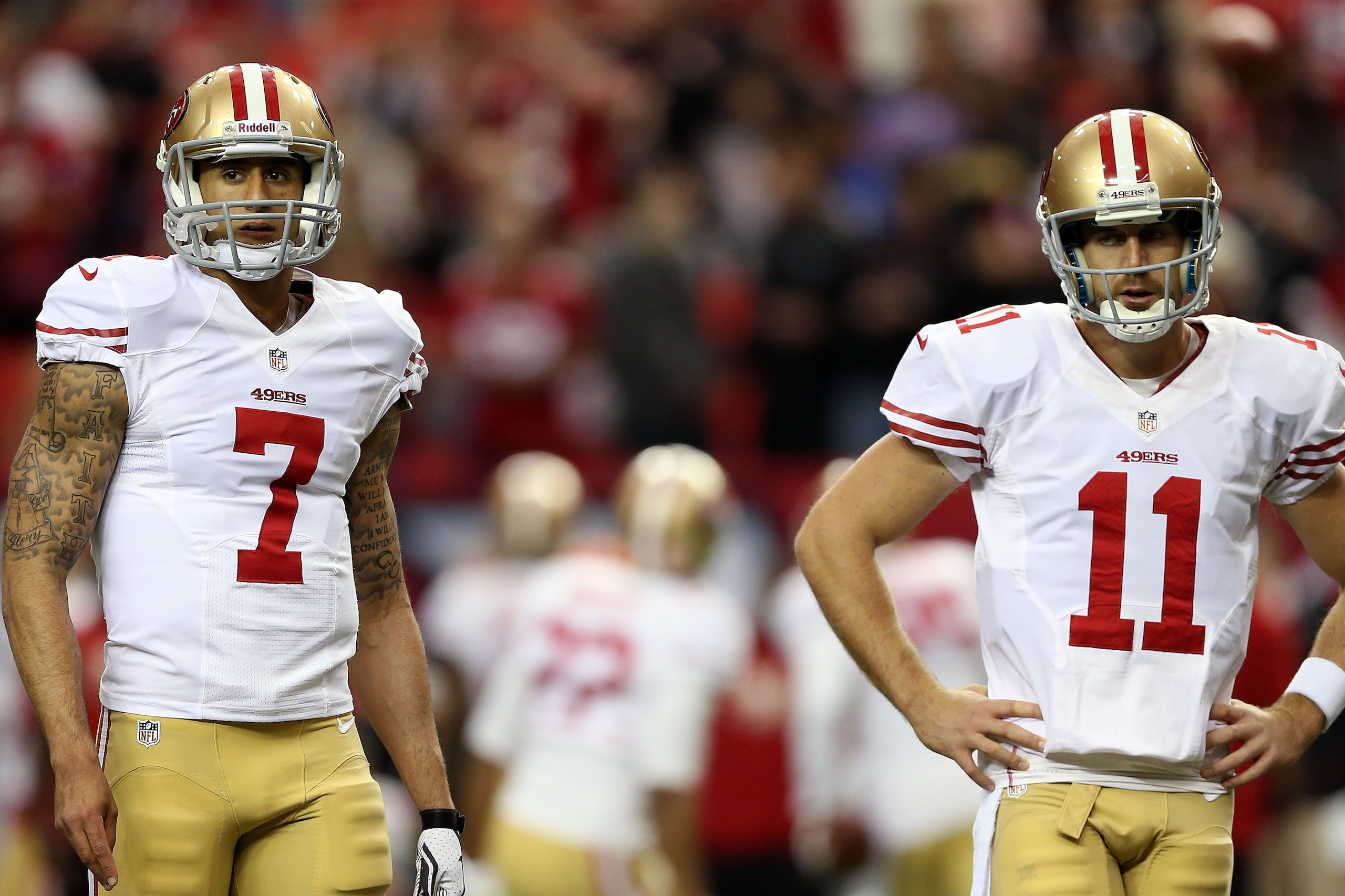 ATLANTA, GA - JANUARY 20:  Quarterbacks Colin Kaepernick #7 and quarterback Alex Smith #11 of the San Francisco 49ers warm up before taking on the Atlanta Falcons in the NFC Championship game at the Georgia Dome on January 20, 2013 in Atlanta, Georgia.  (