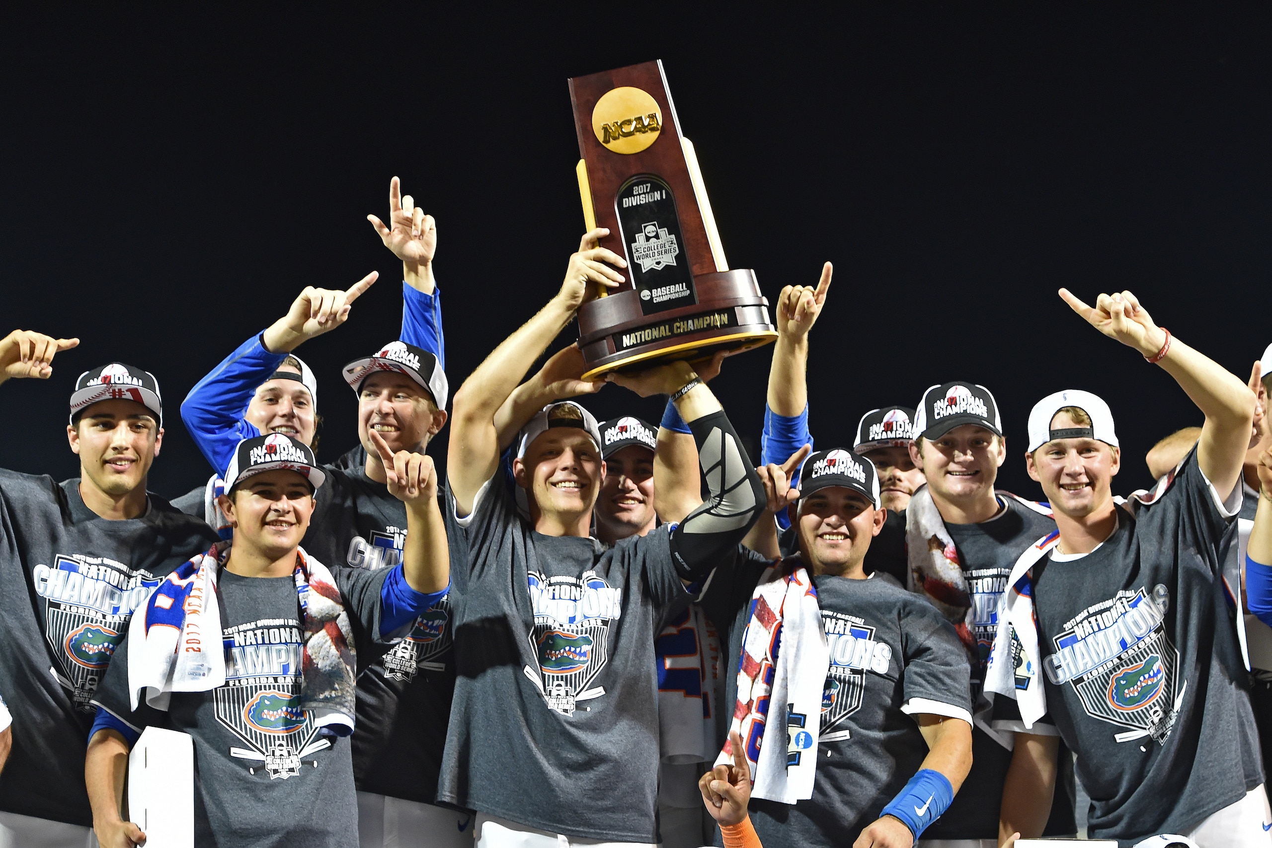OMAHA, NE - JUNE 27:  Players of the Florida Gators hold up the National Championship Trophy after defeating the LSU Tigers 6-1  at the College World Series on June 27, 2017 at TD Ameritrade Park in Omaha, Nebraska.  (Photo by Peter Aiken/Getty Images)