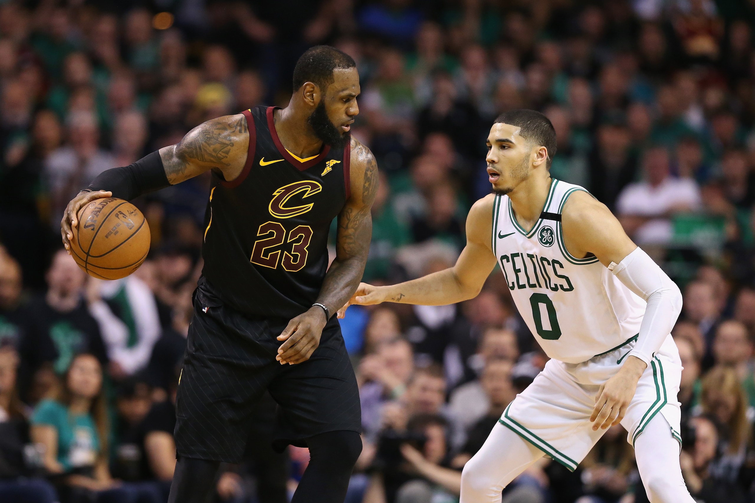 BOSTON, MA - MAY 27: LeBron James #23 of the Cleveland Cavaliers handles the ball against Jayson Tatum #0 of the Boston Celtics in the second half during Game Seven of the 2018 NBA Eastern Conference Finals at TD Garden on May 27, 2018 in Boston, Massach BOSTON, MA - MAY 27: LeBron James #23 of the Cleveland Cavaliers handles the ball against Jayson Tatum #0 of the Boston Celtics in the second half during Game Seven of the 2018 NBA Eastern Conference Finals at TD Garden on May 27, 2018 in Boston, Massach