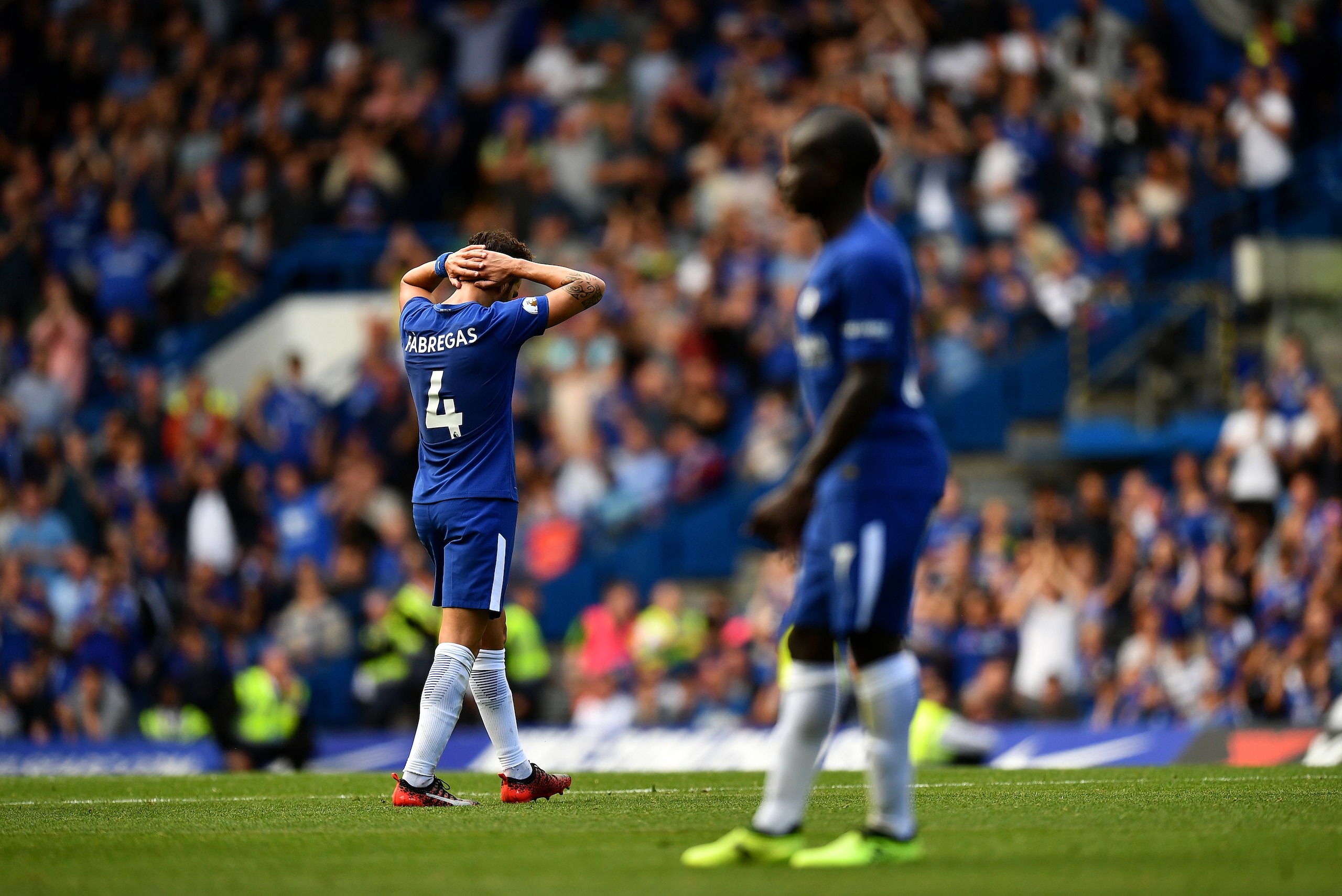 LONDON, ENGLAND - AUGUST 12:  Cesc Fabregas of Chelsea leaves the field dejected after being shown a red card by Referee, Craig Pawson during the Premier League match between Chelsea and Burnley at Stamford Bridge on August 12, 2017 in London, England. (P