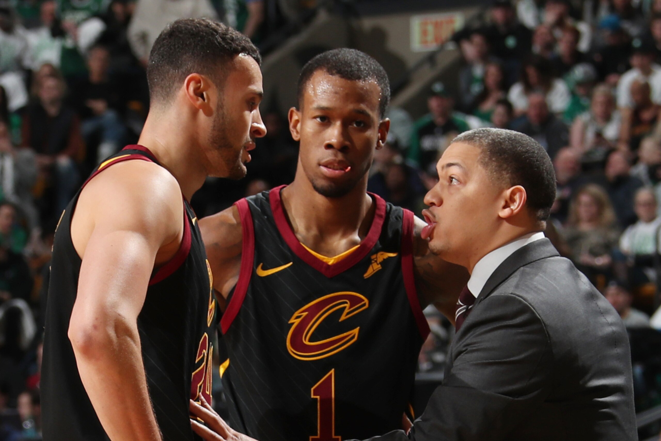 CLEVELAND, OH - FEBRUARY 11: Coach Tyronn Lue  speaks with Larry Nance Jr. #24 and Rodney Hood #1 of the Cleveland Cavaliers during the game against the Boston Celtics on February 11, 2018 at TD Garden in Boston, Massachusetts.  NOTE TO USER: User express