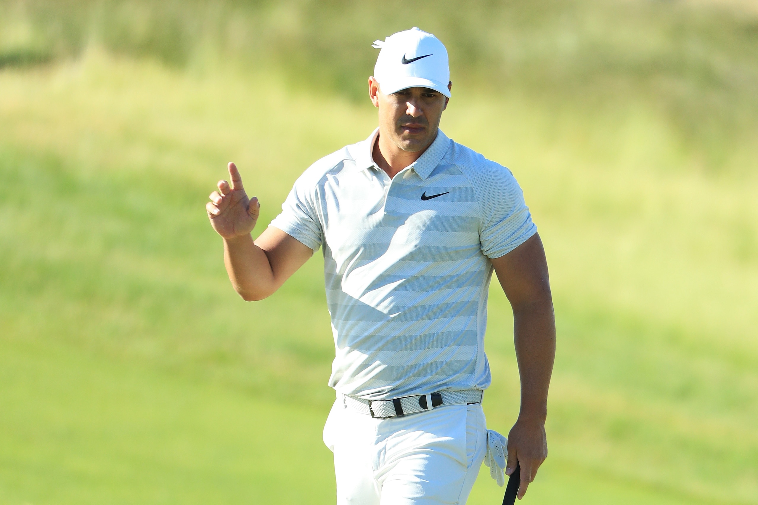 SOUTHAMPTON, NY - JUNE 14:  Brooks Koepka of the United States waves after making a birdie on the first hole during the first round of the 2018 U.S. Open at Shinnecock Hills Golf Club on June 14, 2018 in Southampton, New York.  (Photo by Andrew Redington/
