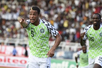 Nigerian defender William Ekong (L) points to the crowd to celebrate his goal during an international friendly football match between Nigeria and DR Congo on May 28.