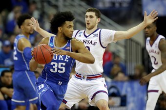 OMAHA, NE - MARCH 25:  Marvin Bagley III #35 of the Duke Blue Devils looks to passes the ball against Sviatoslav Mykhailiuk #10 of the Kansas Jayhawks during the second half in the 2018 NCAA Men's Basketball Tournament Midwest Regional at CenturyLink Cent