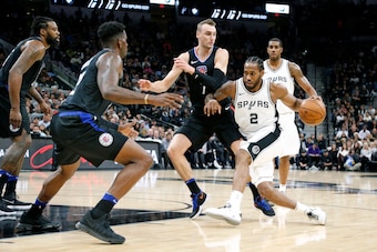 SAN ANTONIO,TX - DECEMBER 18 :  Kawhi Leonard #2 of the San Antonio Spurs tries to drive on Sam Dekker #7 of the Los Angeles Clippersat AT&T Center on December 18, 2017 in San Antonio, Texas.  NOTE TO USER: User expressly acknowledges and agrees that , by