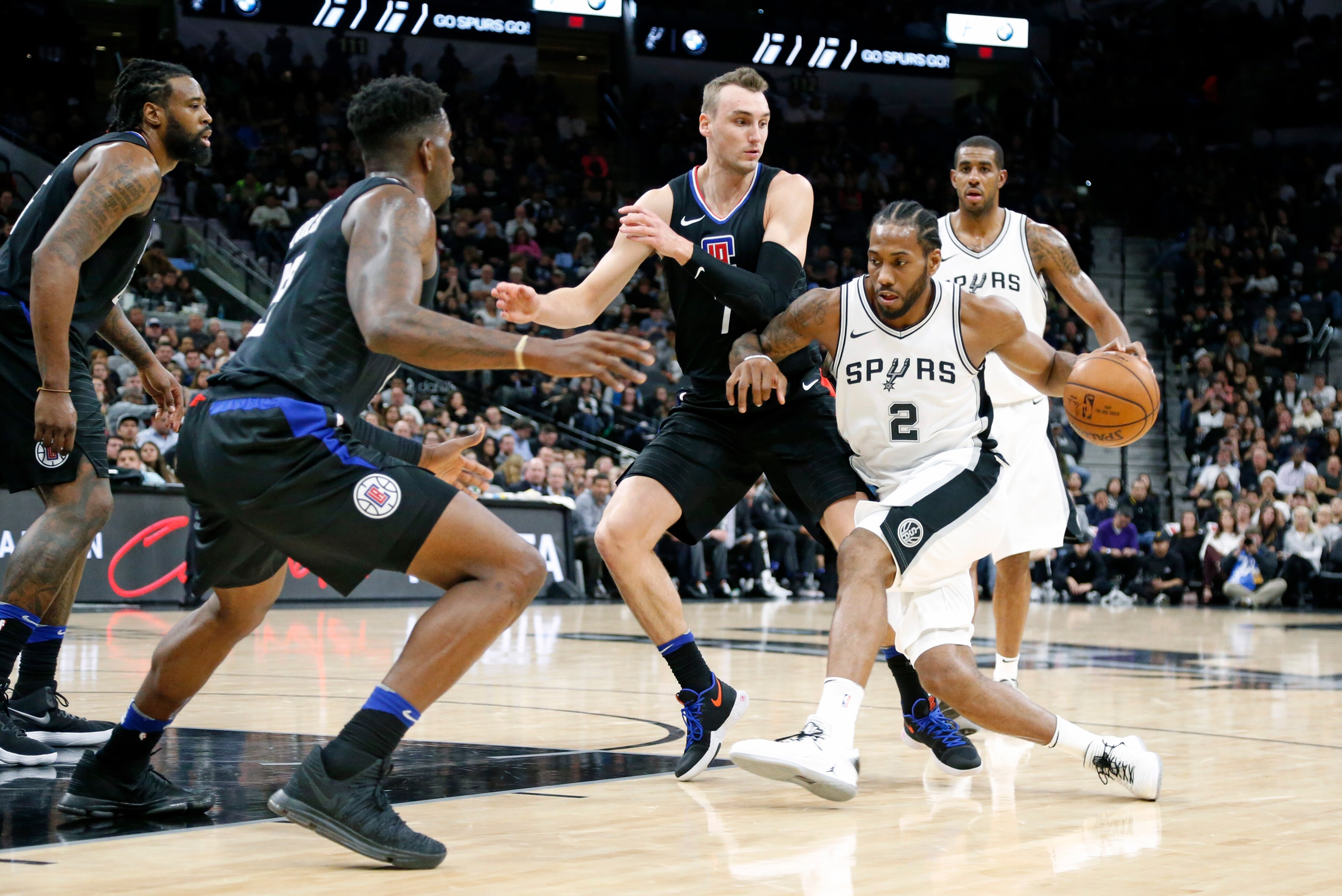 SAN ANTONIO,TX - DECEMBER 18 :  Kawhi Leonard #2 of the San Antonio Spurs tries to drive on Sam Dekker #7 of the Los Angeles Clippersat AT&T Center on December 18, 2017 in San Antonio, Texas.  NOTE TO USER: User expressly acknowledges and agrees that , by