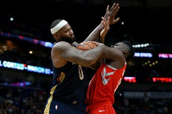 NEW ORLEANS, LA - JANUARY 26:  DeMarcus Cousins #0 of the New Orleans Pelicans fights for a loose ball with Clint Capela #15 of the Houston Rockets during the second half at the Smoothie King Center on January 26, 2018 in New Orleans, Louisiana. NOTE TO U