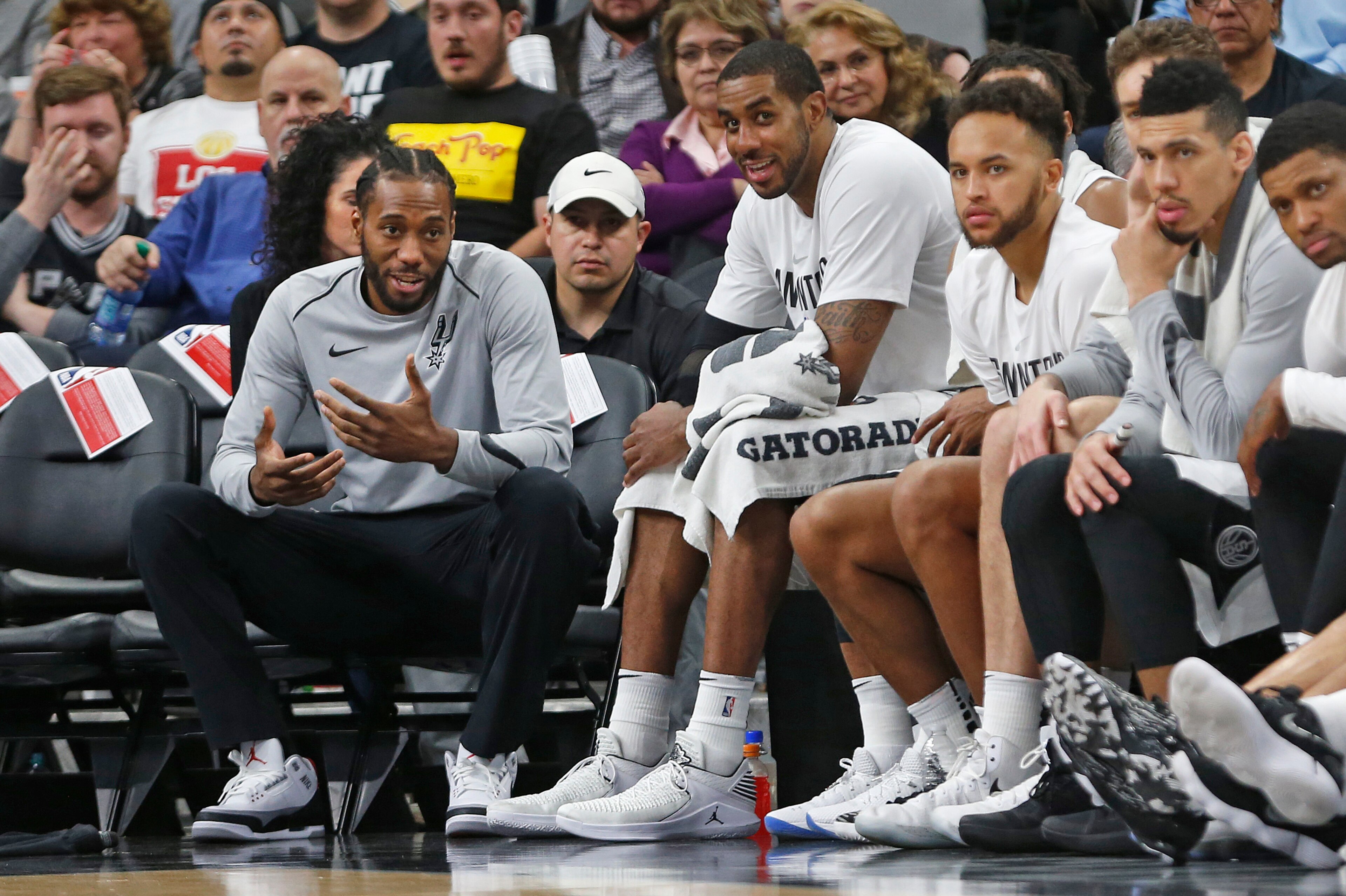 SAN ANTONIO,TX - MARCH 13 :  Kawhi Leonard #2 of the San Antonio Spurs still not playing talks with teammate LaMarcus Aldridge #12 of the San Antonio Spurs during game against the Orlando Magic at AT&T Center on March 13, 2018  in San Antonio, Texas.  NOT