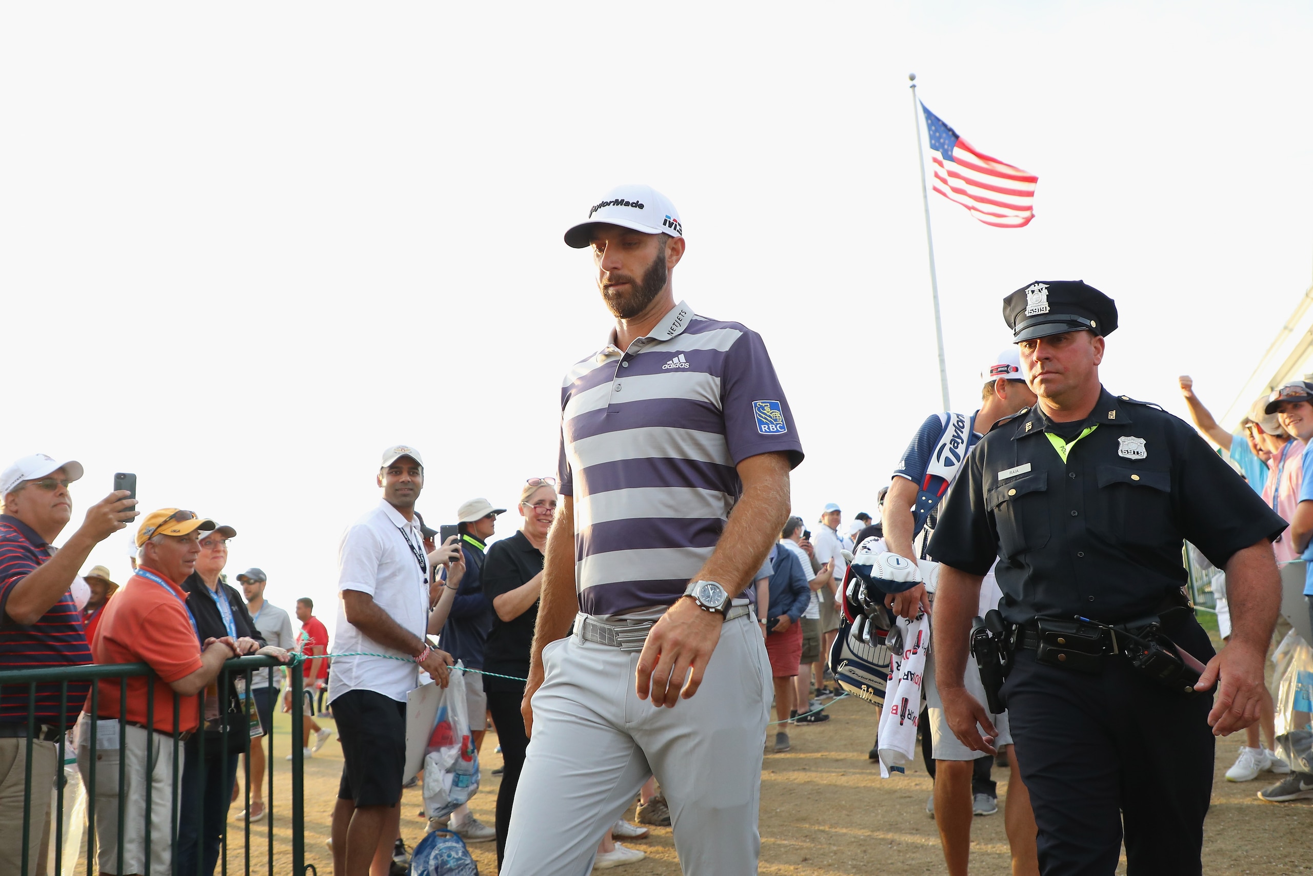 SOUTHAMPTON, NY - JUNE 16: Dustin Johnson of the United States walks off the 18th green during the third round of the 2018 U.S. Open at Shinnecock Hills Golf Club on June 16, 2018 in Southampton, New York.  (Photo by Warren Little/Getty Images)