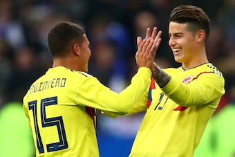 PARIS, FRANCE - MARCH 23:  Juan Quintero of Columbia celebrates with teammate James Rodríguez after scoring his sides third goal during the International friendly match between France and Columbia at Stade de France on March 23, 2018 in Paris, France.  (P