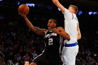 NEW YORK, NY - FEBRUARY 12:  (NEW YORK DAILIES OUT)    Kawhi Leonard #2 of the San Antonio Spurs in action against Kristaps Porzingis #6 of the New York Knicks at Madison Square Garden on February 12, 2017 in New York City. The Knicks defeated the Spurs 9