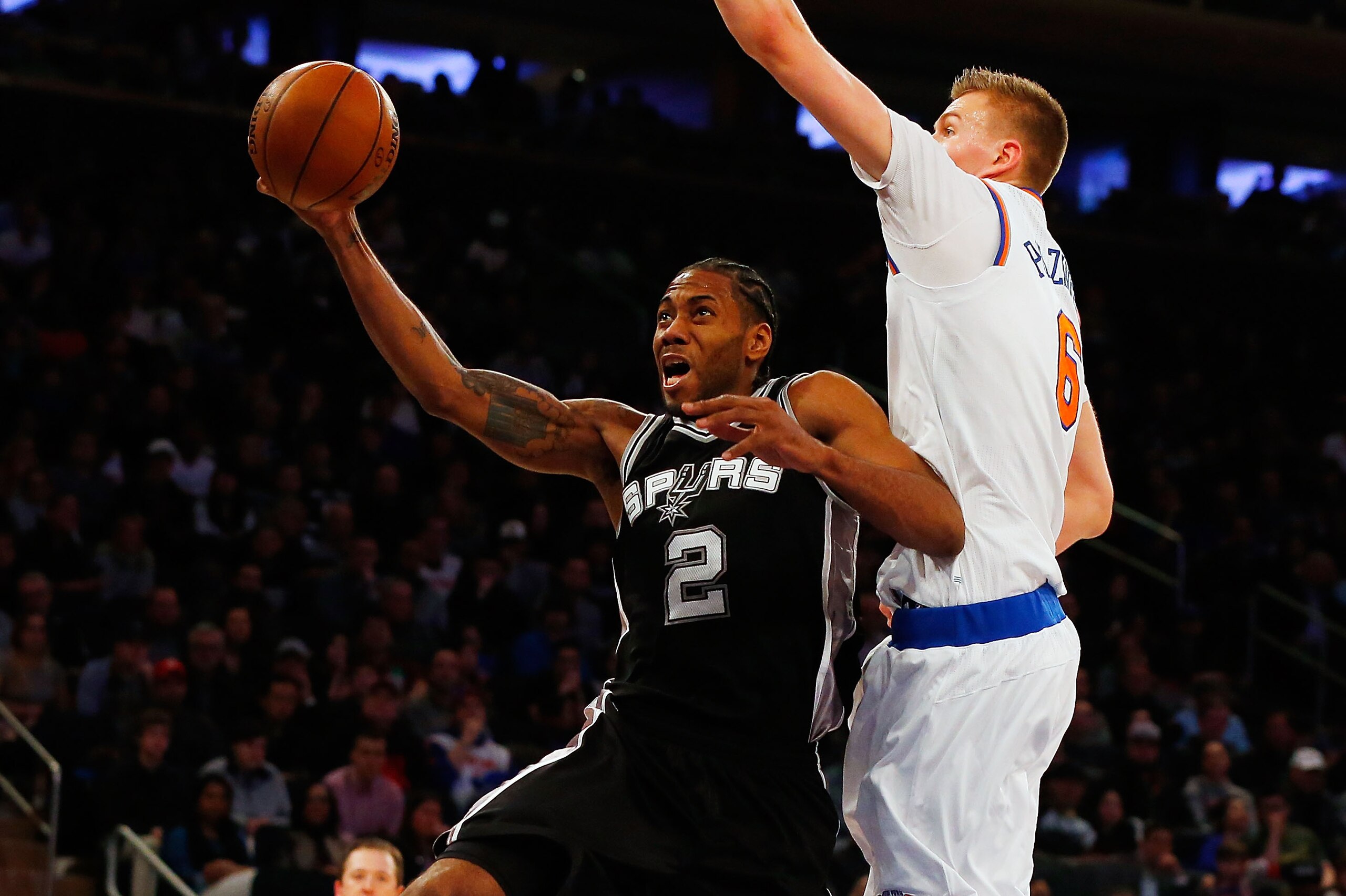 NEW YORK, NY - FEBRUARY 12:  (NEW YORK DAILIES OUT)    Kawhi Leonard #2 of the San Antonio Spurs in action against Kristaps Porzingis #6 of the New York Knicks at Madison Square Garden on February 12, 2017 in New York City. The Knicks defeated the Spurs 9