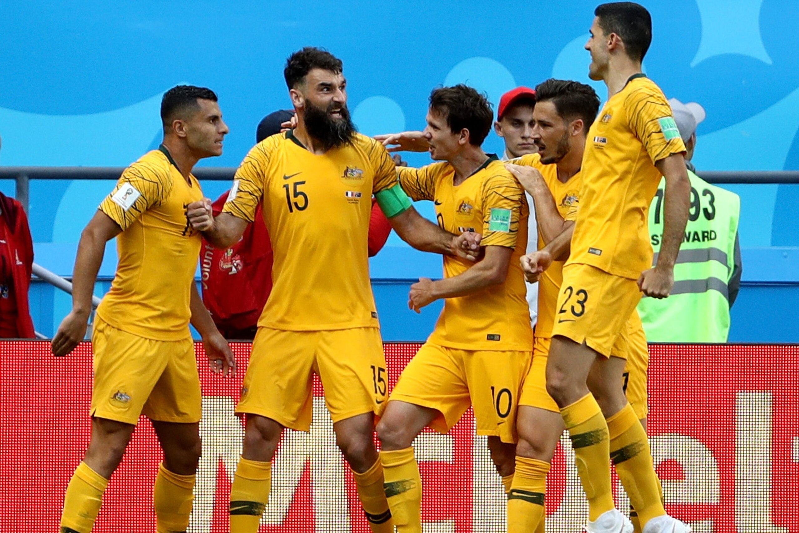 KAZAN, RUSSIA - JUNE 16: Mile Jedinak of Australia celebrates after scoring his team's first goal, from a penalty, with team mates during the 2018 FIFA World Cup Russia group C match between France and Australia at Kazan Arena on June 16, 2018 in Kazan, R